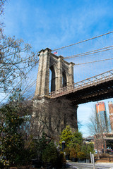 A view of a Brooklyn Bridge from a park in DUMBO