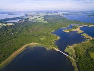 Aerial view of beautiful landscape of lake district, bridge between Dargin and Kirsajty Lakes, next Mamry Lake, Mazury, Poland