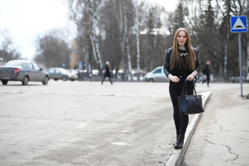 Young cute girl on a walk in the city