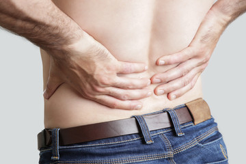 Naklejka premium Studio shot of young man with pain in back