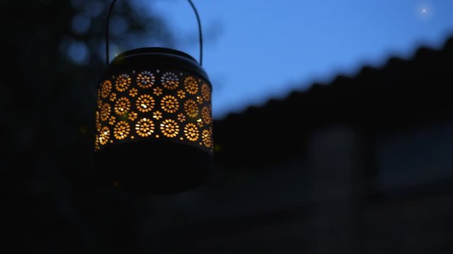 Cinemagraph - Lantern  with magical lights of fireflies at night  . Concept of romance. Motion Photo.