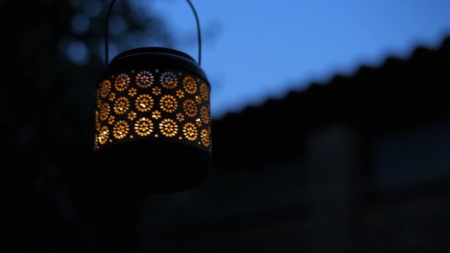 Cinemagraph - Lantern  with burning light at night . Concept of romance. Motion Photo.