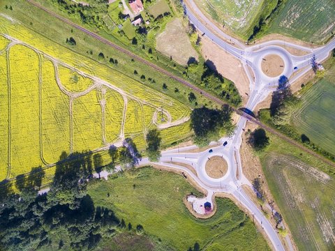 Aerial view of roundabout circles, railroad line and bike lanes near Wegorzewo town, Mazury, Poland