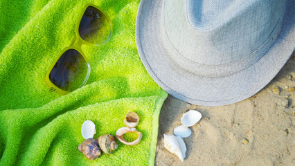 Fototapeta na wymiar Accessories for beach holidays on the sand.