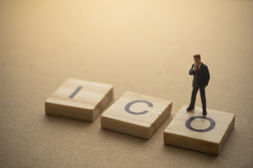 Businessman thinking about invest ICO initial coin offering concept