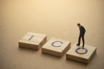 Businessman thinking about invest ICO initial coin offering concept
