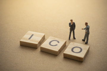 Businessman thinking about invest ICO initial coin offering concept
