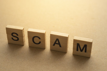 SCAM letter on wood plate