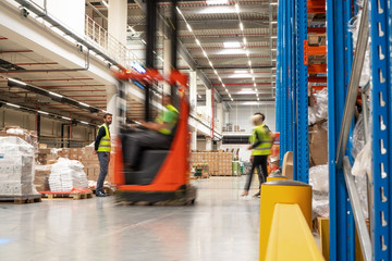 Warehouse workers blurred