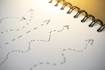 Different arrow path draw on white paper.