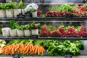 Fresh organic green vegetables on display in a French supermarket. Paris, France