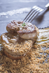Fried Foie Gras with Mango Puree on Dark Stone Background. French Cuisine Concept.