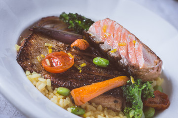 Salmon Fillet with Vegetables on Rustic White Plate