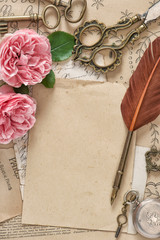 Old letters antique feather pen pink rose flowers Paper background © LiliGraphie