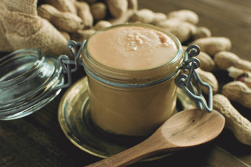 Homemade Peanut Butter in Glass Jar as Healthy Breakfast Vegetarian Food Concept