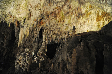 underground view of stalactites and stalagmites in natural halls in Postojna cave, Slovenia, Europe