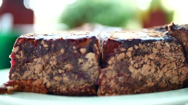 Chocolate cake piece. Sliced tasty chocolate cake on table background