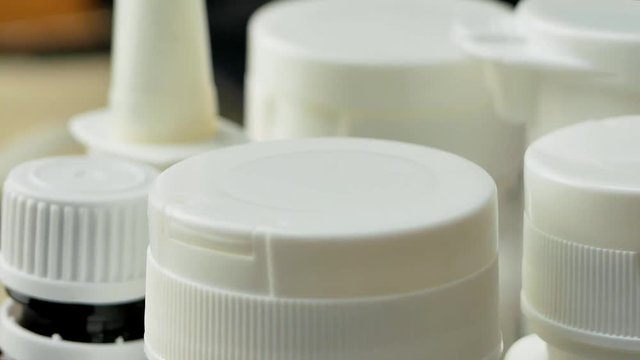 White plastic bottle with medications or pills