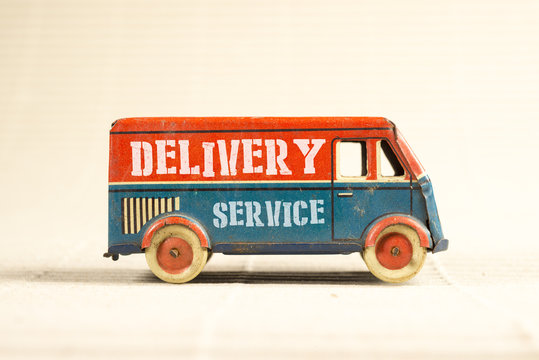 Delivery service vintage toy truck.
Shipping concept.
