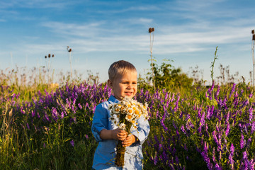 Cute boy with flowers
