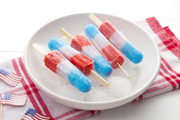 Red White and Blue Popsicles in a Bowl of Ice to Keep them Cool for Serving to your BBQ Guests