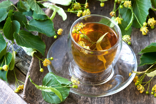 Glass of herbal tea with linden flowers