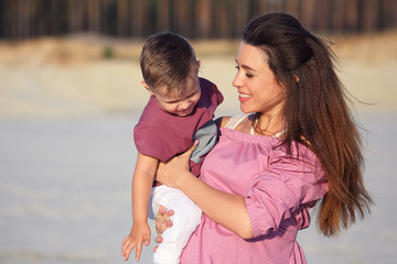happy mom with her baby in her arms