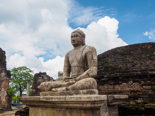 Fototapeta na wymiar The ancient sitting Buddha statue at Vatadage temple in Polonnaruwa ancient city (846 AD Ð 1302 AD), Sri Lanka.