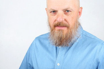 bearded man in blue denim shirt