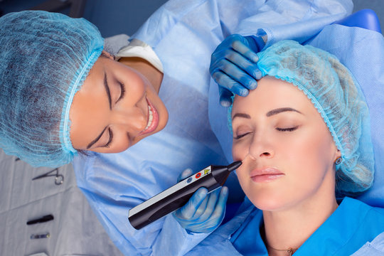 Woman having a non surgical procedure to remove nasolabial wrinkles