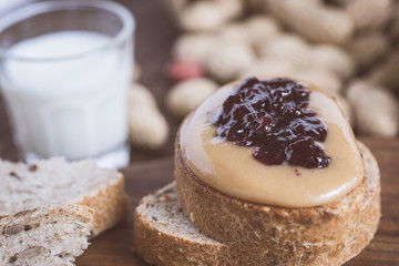 Fresh Peanut Butter and Jelly Sandwich on Old Rustic Wooden Cutting Board