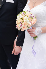 Bride and groom standing together on ceremony