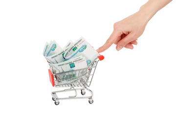 Hand with Russian rubles in the shopping cart, isolated