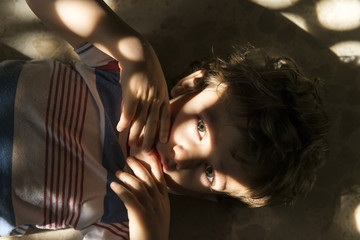 Portrait of child with lights and shadows.