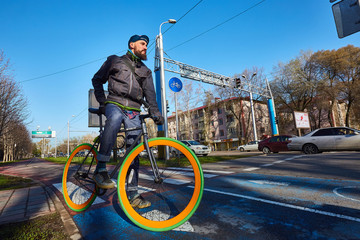 Man with a bicycle in the city. Eco-friendly mode of transport