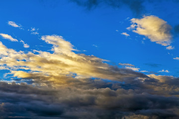 Fototapeta premium Fancy shapes of clouds at evening sunset.