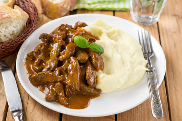 Beef stroganoff in tomato gravy with sour cream