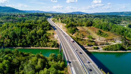 Highway on bridge going over river with trafic and beautiful nature, Croatia