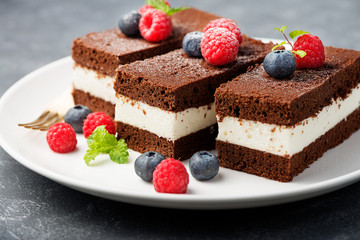 Chocolate creamy cake with  fresh berries.