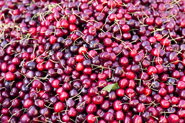 Pile of ripe cherries. Fruits and vegetables at a farmers market