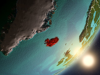 Sun rising above Iceland from space