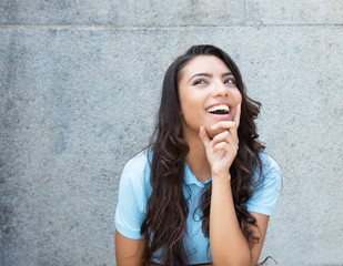 Happy latin american woman with long hair outdoor in the summer