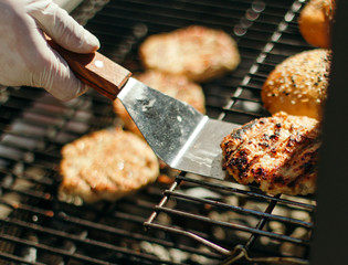 Buns for hamburgers with sesame, grilled meatballs.