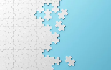Jigsaw puzzle, pattern texture separated on blue background. 3d illustration © tampatra