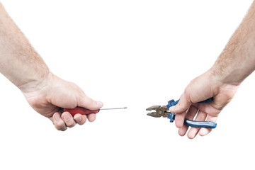 Male hands holding a screwdriver and pliers isolated on a white background, a first-person view