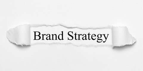 Brand Strategy on white torn paper