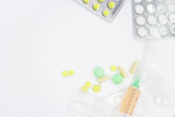 Many different medicines on a light background.