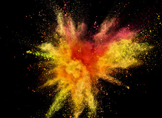 Colored powder explosion isolated on black background.