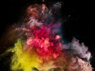 Plakat Colored powder explosion isolated on black background.