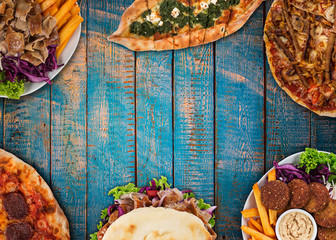 Top down view on traditional turkish meals on vintage wooden table.